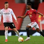 Diogo Dalot del Milan fronteggia Amad Diallo del Manchester United